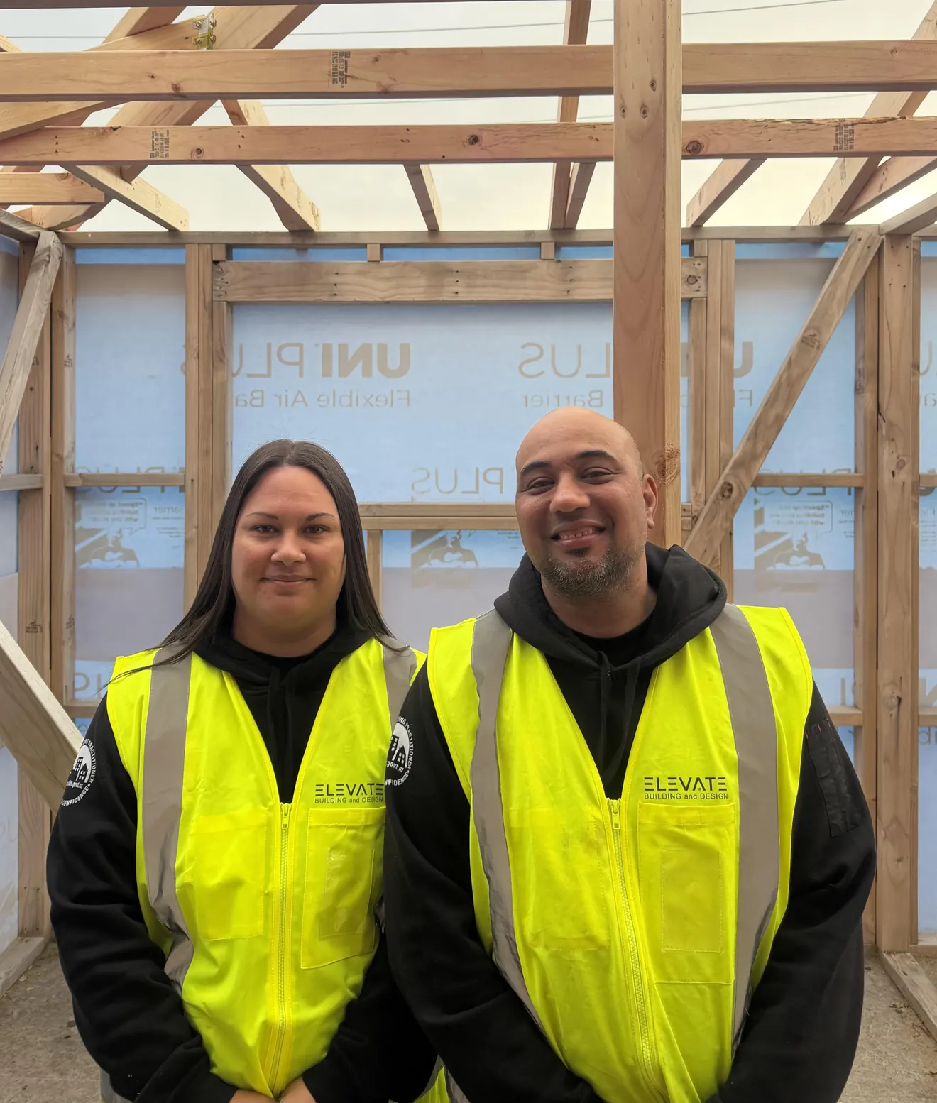 Lawrence and Mandy Lokeni, owners of Elevate Building and Design, in Hi-Vis vests on site